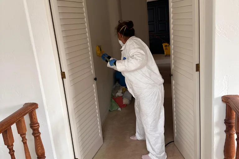 Technician treating water damage in a Santa Monica multi-level property