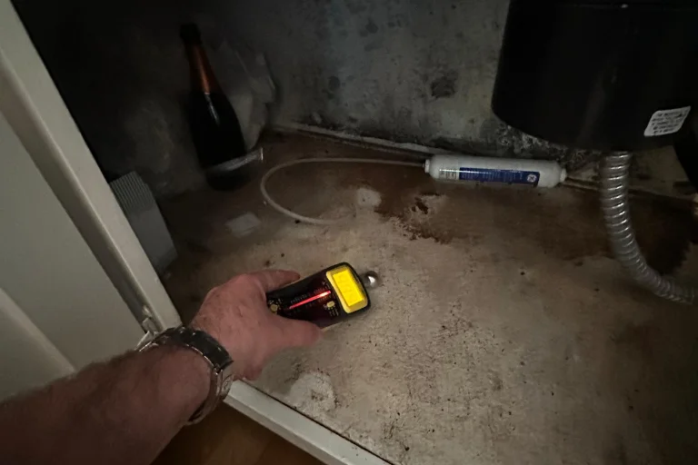 Moisture testing near a plumbing line in a Sherman Oaks home