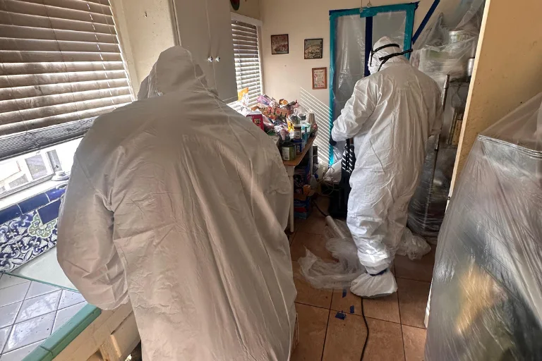 Technicians containing a water-damaged area in a Burbank building
