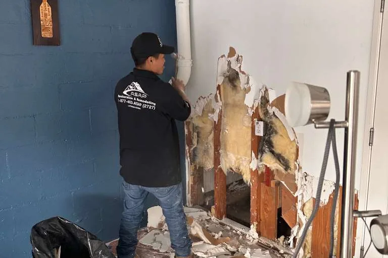 Removing water-damaged material in a Pasadena home