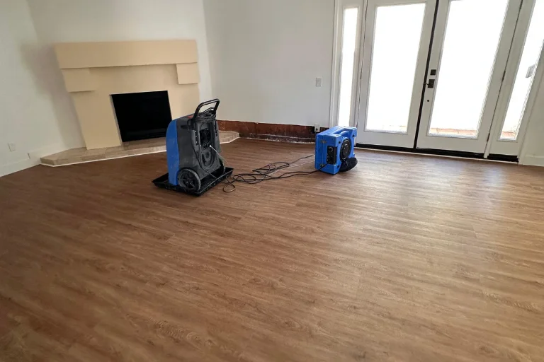 Air movers drying hardwood flooring in a Glendale living room