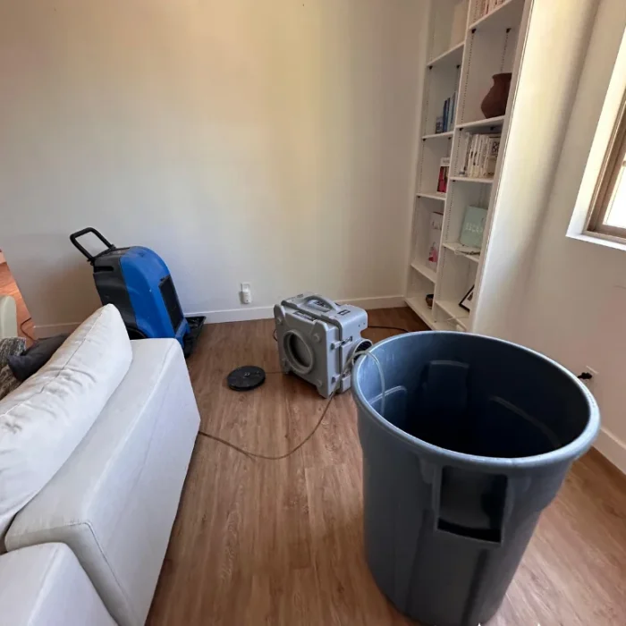 Air mover drying a Long Beach living room after water damage